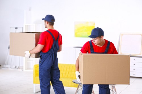 Professional movers preparing furniture for pick-up