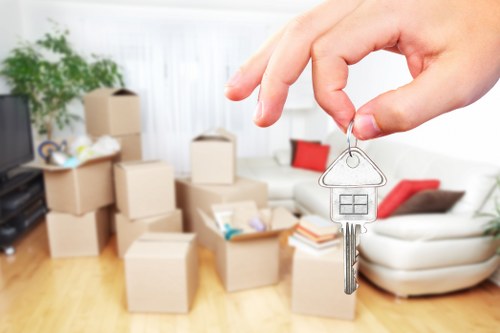Professional movers handling office equipment
