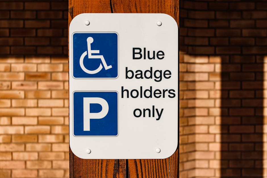 Four blue parking permit signs attached to black metal poles are displayed against a modern corrugated metal wall. The signs feature a large white 'P' indicating parking, with smaller text below readi